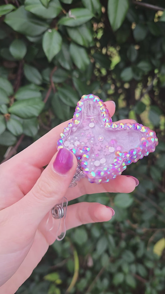 Purple butterfly badge reel shaker